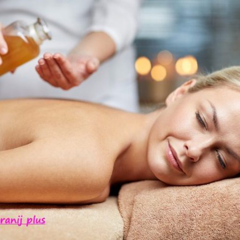 people, beauty, spa, healthy lifestyle and relaxation concept - close up of beautiful young woman lying with closed eyes on massage table and therapist holding oil bottle in spa ID:80329151